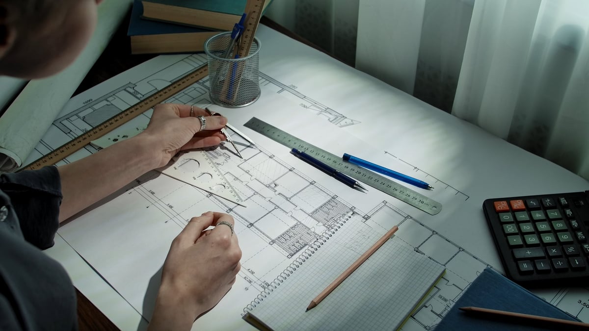 Workspace with blueprints and drafting tools