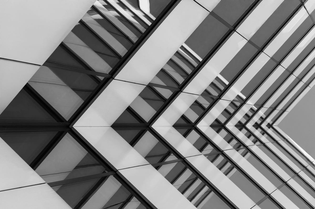 Black and white photo of modern glass building facade