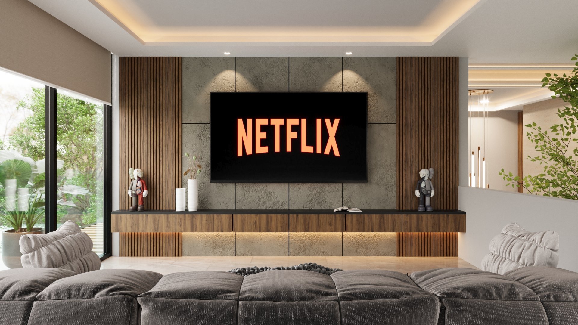 Modern living room with wall-mounted TV displaying Netflix logo, gray sofa, and wooden media console with decorative accents